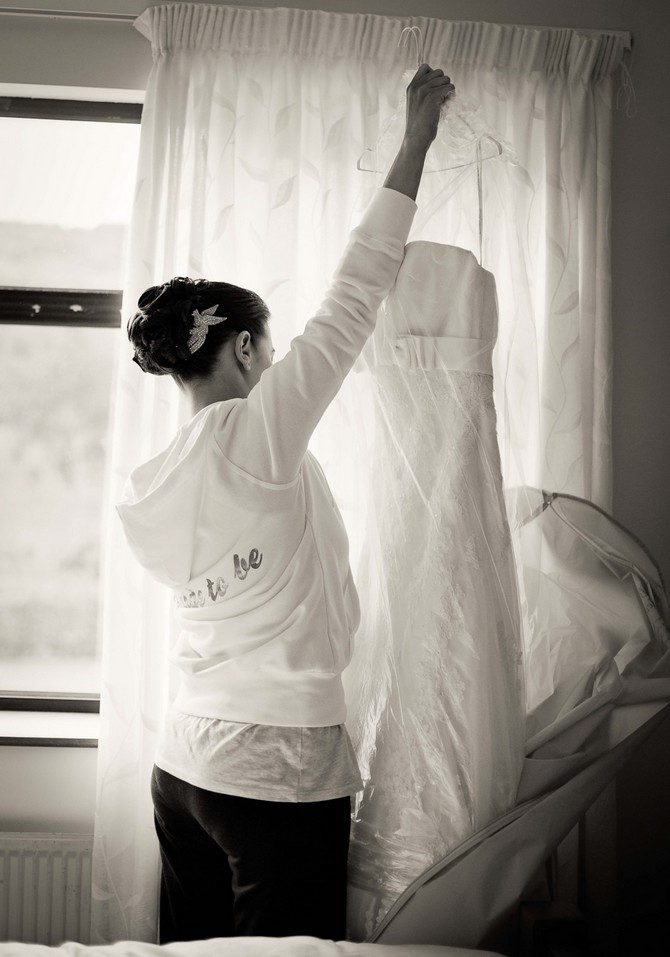 Wedding dress photography. Tara Aherne Photography real wedding bride hanging wedding dress